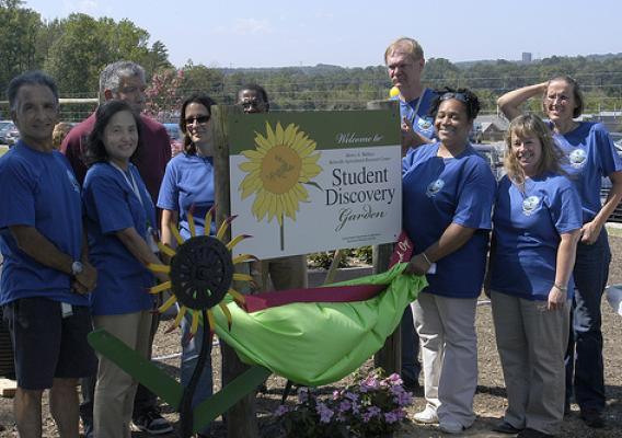Beltsville Agricultural Research Center (BARC) employees at the unveiling of the sign for the BARC Student Discovery Garden.
