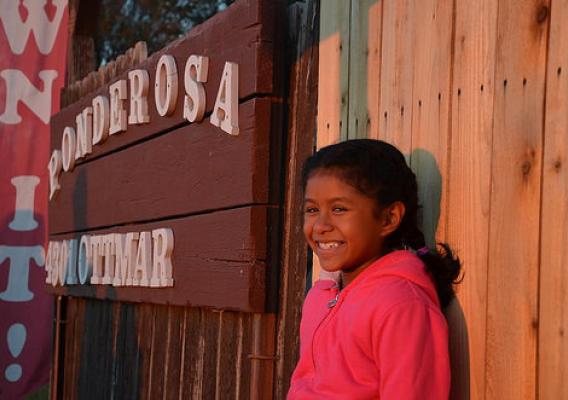 A young resident of the Ponderosa Homeowners Cooperative was among those celebrating the conversion of their community to a resident-owned co-op. Photo by Mike Bullard, courtesy ROC USA