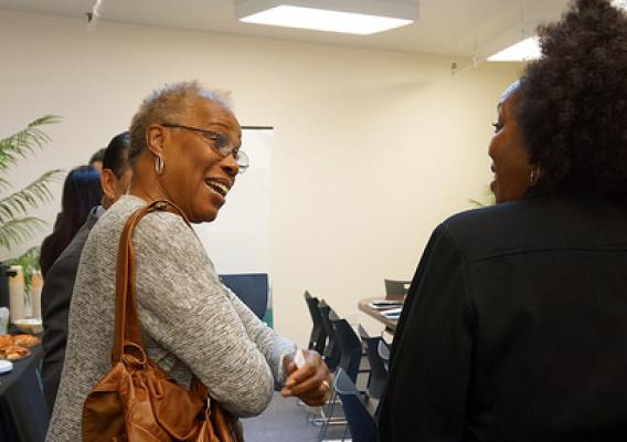 Administrator Rowe speaking with an attendee at the Jobs NOW! event in San Francisco