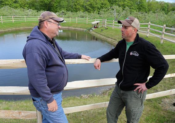 Al Rose discusses his fourth-generation Red Apple “green” Farm with NRCS’ Soil Conservationist Dave Bacon.