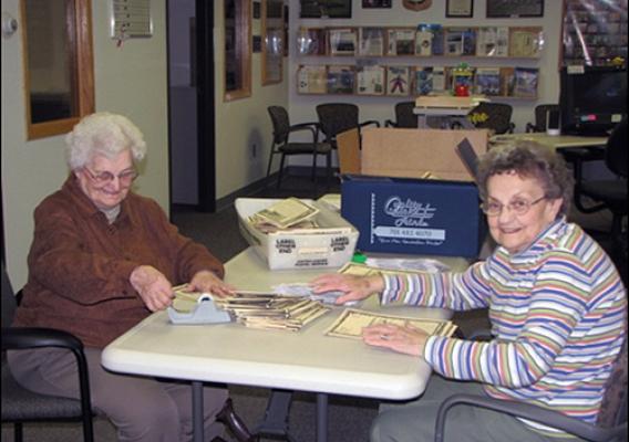 Earth Team Volunteers  Lyla Schulz and Jean Herauf (L to R) prepare a conservation mailing to famers in the Dickinson, N.D., NRCS office.  