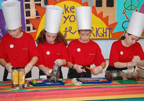 Intent on their work, Charter Oak student chefs carefully assemble their competition entry Fiesta Wrap.