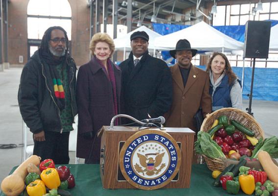 Malik Yakini, Executive Director of the Detroit Black Community Security Network and Manager of D-Town Farms; U.S. Senator Debbie Stabenow; NRCS State Conservationist Garry Lee; Southeast Michigan Resource Conservation & Development Council Board President Morse Brown and Ashley Akinson, Executive Director of Keep Growing Detroit (l-r) were together at Detroit’s Eastern Market to announce new funding for city high-tunnels. Photo by Brian Buehler, Public Affairs Specialist, USDA Natural Resources Conservatio
