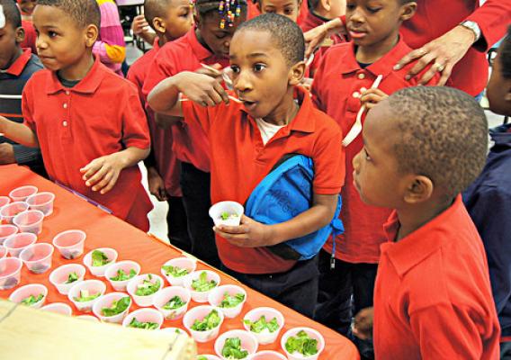 On March 7, 2014, students at J.C. Nalle Elementary School sampled three different kinds of spinach. After the taste test, they cast their vote to decide which type they like best. The winner? Spinach salad! (Photo courtesy of D.C. Central Kitchen)