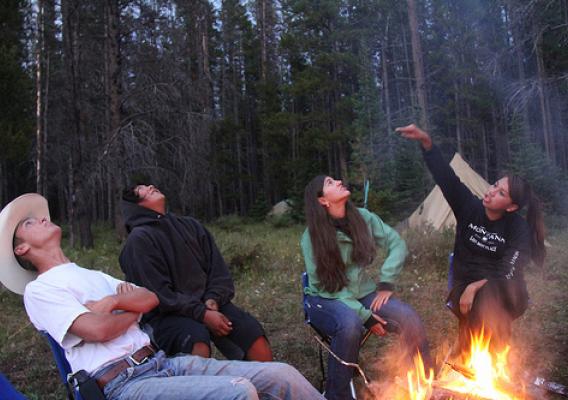 Youth who were part of the filming of “Untrammeled” marvel at the stars appearing overhead, as twilight descends on camp in the Scapegoat Wilderness. (U.S. Forest Service)