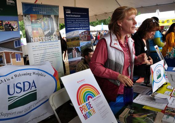 Lissa Biehn (left) with FSA and Ramona Mitchell, Rural Development, discuss USDA’s dedication to civil rights in employment and program delivery at the Northwest Pride Festival in Portland, OR, on June 14.
