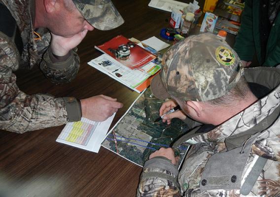 U.S. Forest Service employees Michael Sowell (right) and Lanton Chumley plan where to locate hunter blinds. The goal is to ensure sites are accessible to accommodate hunters with varying disabilities. (U.S. Forest Service/Mandy Chumley)
