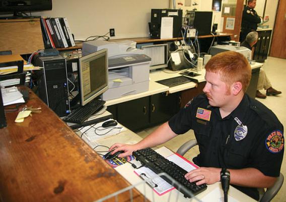 Patrolman Josh Kennedy at his desk