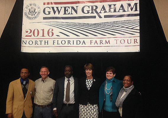 USDA Deputy Secretary Krysta Harden and Congresswoman Gwen Graham standing with others at the 2016 North Florida Farm Tour