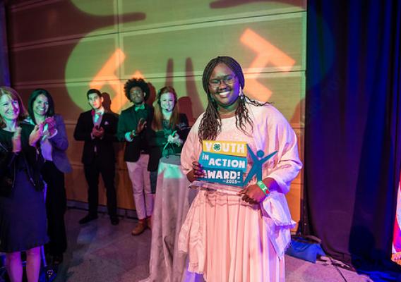 Nosa Akol, CITIZEN U teen leader in Binghamton, New York holding her award