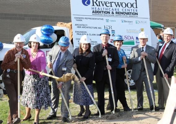 Minnesota State Director Colleen Landkamer (second from left) and Administrator Trevino (fourth from left) throw some dirt at the groundbreaking for Riverwood Healthcare’s expansion in Aitkin, Minn.