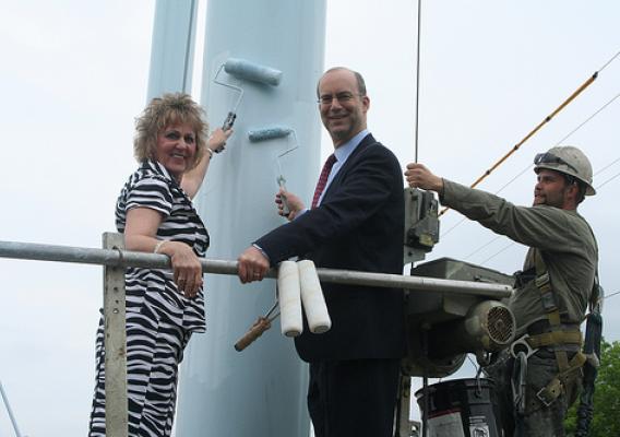 Anita J. (Janie) Dunning, Missouri State Director, and Jonathan Adelstein, RUS Administrator (center), painting the Ralls County PWSD No. 1 water tower
