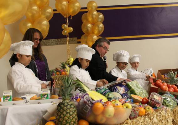 Salida Union School District’s Child Nutrition Services Director, Chef Billy Reid (right), Tammy Zeiger (left), a member of his team, and several students demonstrate how to cook a healthy school lunch using USDA Foods.