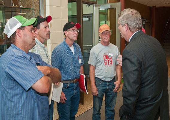 From left: Farmers Steve Roth, Done Rief, Dale Rief, Clifford Dilts discuss topics covered during a town hall meeting with Agriculture Secretary Tom Vilsack at the Glenwood Community High School in Glenwood, Iowa on Thursday, June 16, 2011. Farmers, local and regional media listened and questioned Secretary Vilsack on the cause of the floodwaters along the Missouri River affecting Iowa and Nebraska. Secretary Vilsack offered advice and assistance available through the United States Department of Agriculture