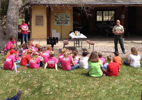 Richard Gilbert, Bessey Nursery Manager talks with students from Sandhills Public Schools about the seed collection process, growing process and replanting. (U.S. Forest Service/Tim Buskirk)