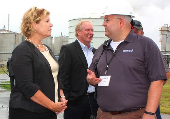 USDA Rural Business-Cooperative Service Administrator Lillian Salerno listens as Erik Chaffer, environmental health, safety and logistics manager for Three Rivers Energy, recounts the long-hoped for reopening of the ethanol plant he helped mothball in 2008 during the Great Recession. Located in rural Coshocton County, Ohio, the plant employs nearly 40 area residents and purchases corn from local farmers. (USDA photo: Heather Hartley)