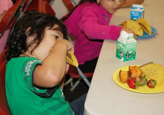 A student from DC Bilingual Public Charter School enjoys a taco.