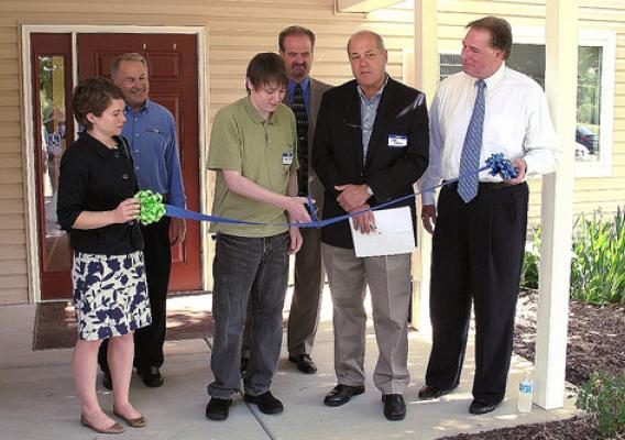 Ribbon-cutting at Kalamink Creek Apartments.  From left:  Melissa Horste, staffer for U.S. Sen. Carl Levin; Senior Vice President of the Great Lakes Capital Fund Tom Edmiston, resident Ryan Kainath; USDA Rural Development Mason Area Office Director Kevin Smith; Owner/Contractor Jeff Gates; co-owner Tom Lapka (USDA Photo)