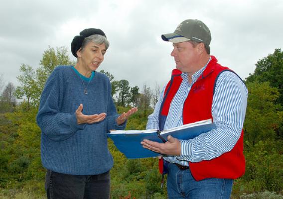 Theresa Lackey talks to NRCS District Conservationist Tony Hoover about planned improvements to her land. (NRCS photo)