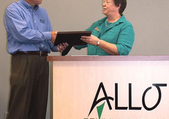 State Director Maxine Moul presents plaque to the President of Allo, Brad Moline for the Recovery Act funds Allo Communications secured to improve telecommunications services in part of Nebraska.