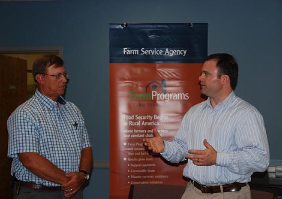FSA Administrator Jonathan Coppess (right) speaks with cotton farmer Sanford Peeples about the benefits of Recovery Act funding that has supported several FSA programs.