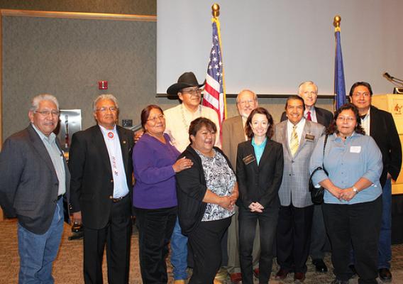Tribal Consultation:  Front row, left to right, Phillip Chimburas, Ute Indian Tribe; Ernest House, Chairman, Ute Mountain; Leona Eyetoo, South Ute Tribe; Jeanine Borchardt, Chairwoman, Paiute Tribe; Jessica Zufolo, Deputy Administrator, Rural Utilities Service; Forrest S. Cuch, Director, Division of Indian Affairs:  Madeline Greymountain, Tribal Council Member, Confederate Tribes of Goshute Reservations. Back row: Kenneth Maryboy, Navajo, UTL Chair; Dave Conine, Utah State Director, USDA Rural Development; 