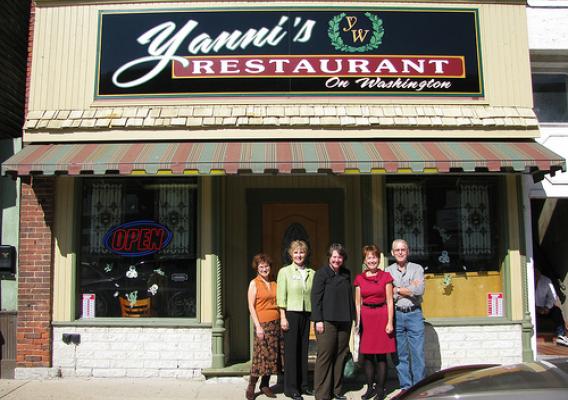 Deputy Secretary Kathleen Merrigan stopped at Yannis Restaurant on her tour of businesses that benefitted from a revolving loan program funded by a USDA grant to renovate their historic buildings. From left, Main Street Momence board member Fran LeBeau, USDA Rural Development State Director Colleen Callahan, Merrigan, Main Street Momence Executive Director Janine Loftus, and building owner John Valaveris. 