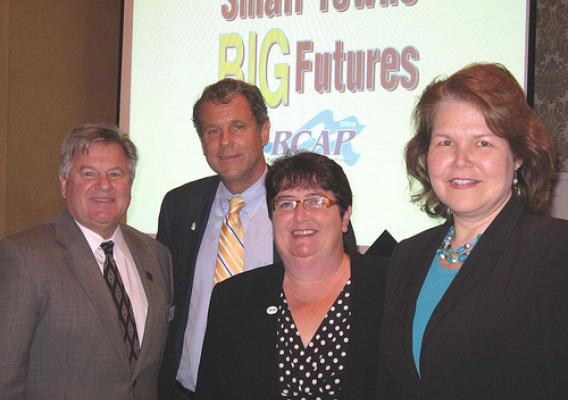(Left to right) Ohio Rural Development State Director Tony Logan, Sen. Sherrod Brown, Deb Martin, Great Lakes RCAP Director and Judith Canales, USDA Rural Development Administrator for Business and Cooperative Programs at the Ohio RCAP conference.  