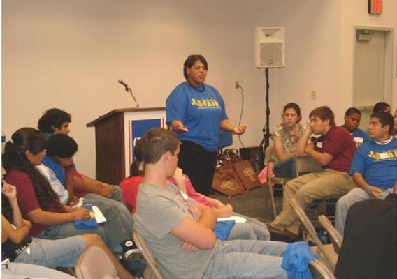 Benita Hodge, a statistician with the NASS Michigan Field Office, works with FFA students at a leadership conference in Texas.
