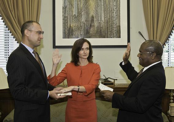 Dr. Elisabeth Hagen is sworn in to her new position as Under Secretary for Food Safety. Pearlie S. Reed, Assistant Secretary for Administration, swears her in as her husband, Dr. Daniel Gabbay, holds the Bible.