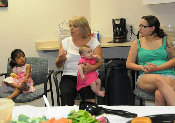 A WIC peer counselor provides encouragement to new mothers at a community breastfeeding support group in West Virginia.