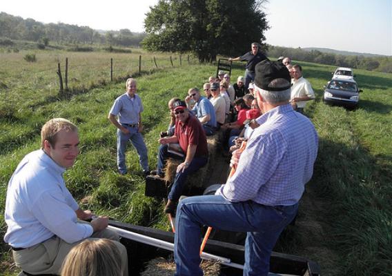 The hayrack provided transportation for those on the conservation tour. Rep. Moran stands in the field as he listens to John Bradley explain plans to improve the field on the left. John’s low-stress grazing system benefits both his cattle and the environment (and makes life a lot easier on him as well).