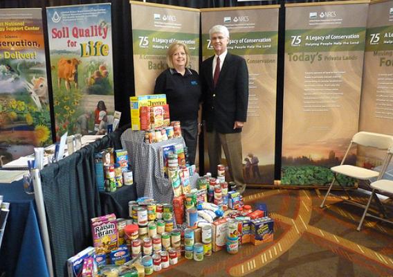 Bonnie Allely, NRCS Earth Team national volunteer liaison, and Jim Gulliford, SWCS executive director, collected more than 250 pounds of food from SWCS conference attendees to fight hunger in St. Louis through the Feds, Farmers and Friends Feed Families food drive. Photo courtesy of SWCS.
