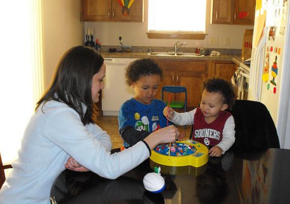 Katie Bowens and children active at play in their new  USDA-financed home.