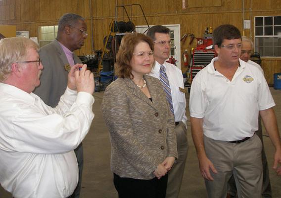 USDA Administrator for Rural Business and Cooperative Programs, Judy Canales (center);  Rural Development State Director, Clarence W. Hawkins (second from left)  and other officials tour the Game Equipment manufacturing plant. 