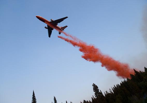 An Airtanker dropping fire retardant on a wildfire