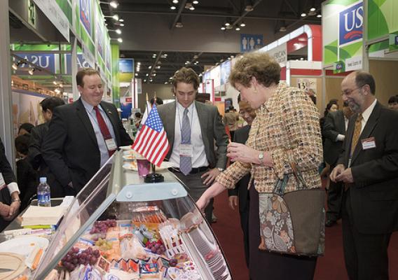 Ambassador Kathleen Stephens examines the wide range of cheeses being exhibited at Seoul Food and Hotel show with  Don Day-Gomes and Blair Tritt, International Sales Managers, for Schreiber Foods, Inc. of Green Bay, Wisconsin.