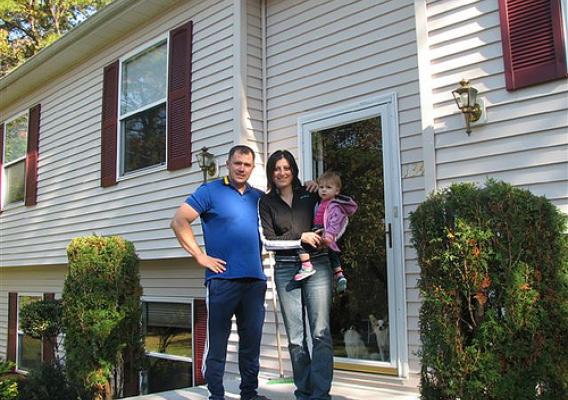 Mihai, Mihaiela, and Sabina Giurca in front of their new USDA-financed home in Egg Harbor Township, New Jersey