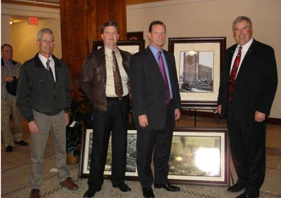 Pictured from left to right in the restored lobby of the Besse Hotel:  Randy Snider, Iola Area Office Director; Dale Yager, Multi Family Housing Specialist; Gary Hassenflu, President, Garrison Community Development, LLC; and Tim Rogers, Housing Programs Director.