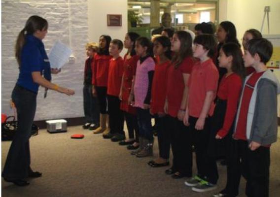 A choral group of fifth graders from an advanced program at Bailey’s Elementary School in Falls Church, VA sing Christmas carols to Forest Service employees of the Yates Building for the Chief’s holiday party on Monday, Dec. 6, 2010. Bailey’s Elementary School is one of six partnership schools collaborating with Sustainable Operations to promote a sustainability ethic and enhance science curriculum for students. Photo by Maritza Huerta.