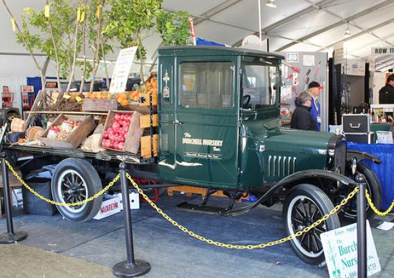 An antique truck serves as an exhibit booth during the expo.