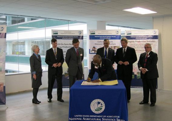 "St. Louis County Executive Charlie A. Dooley signing the dedication certificate at the celebration of the new national operations center for USDA’s National Agricultural Statistics Service in Overland, Mo. He was joined by NASS Administrator Dr. Cynthia Clark, GSA Regional Administrator Jason Klumb, Missouri Director of Agriculture Jon Hagler, U.S. Rep. William “Lacy” Clay, Jr., U.S. Agriculture Secretary Tom Vilsack, and Overland, Mo. Mayor Michael Schneider.“ 