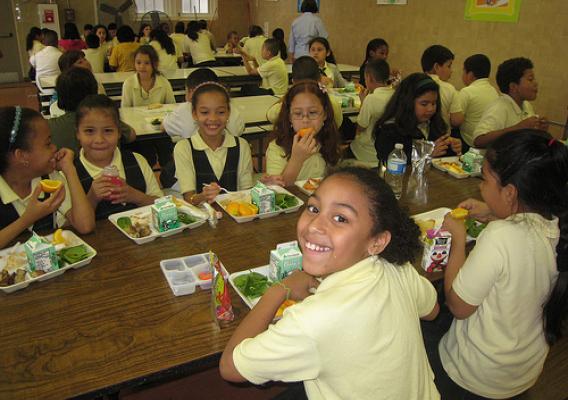 Schoolchildren at Bruce-Monroe Elementary School in Washington, D.C. celebrate lunch after receiving their Gold Award of Distinction honor through USDA’s HealthierUS School Challenge.