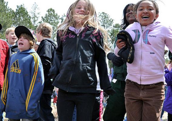 Students from Rockrimmon Elementry School dance with Forest Supervisor during Kids4Trees event on Pike National Forest