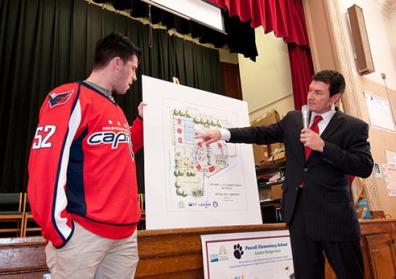 Washington Capitols Defenseman, Number: 52 Mike Green (left) and Comcast SportsNet Analyst Alan May of the The People’s Garden team for W. B. Powell Elementary School, (consisting of the Washington Capitols, U.S. Department of Agriculture and D.C. Public Schools in Washington, D.C.) revealed to 289 parents and students, the School Garden Design Concept on Thursday, March 10, 2011.  The design draft was created by Forest Service landscape architect Matt Arnn, with the support of Natural Resources Conservatio