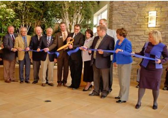 Cutting the ribbon on the PioneerCare facility in Fergus Falls, Minn. The 105-bed senior care center was financed with over $21 million in Recovery Act loans.
