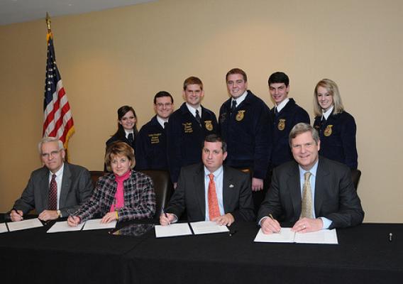 (Left to right) Dwight Armstrong, Melody Alford, Rob Cooper and Agriculture Secretary Tom Vilsack signed a Memorandum of Understanding at the National FFA Foundation Sponsors' Board Meeting on Thursday, January 20, 2011 at the Marriot Metro Center, Washington, D.C.  Behind them are the National FFA Officer Team of (second row, left to right) Shannon L. Norris, Western Region Vice President; Landan Schaffert, Secretary; Riley Pagett, President; Wyatt DeJong, Central Region Vice President; James Flatt, Southe