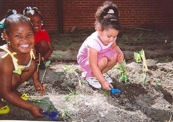 (Left to right) Keniyah Brown, Gerkyhia Walker and Alexis Cook have fun tending their garden at Woodlawn Learning Center in Hopewell, Va.