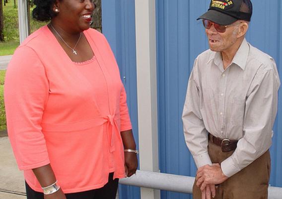 Mississippi Rural Development State Director Trina George listens as a local WWII veteran compliments the agency on its work with the local  water association.