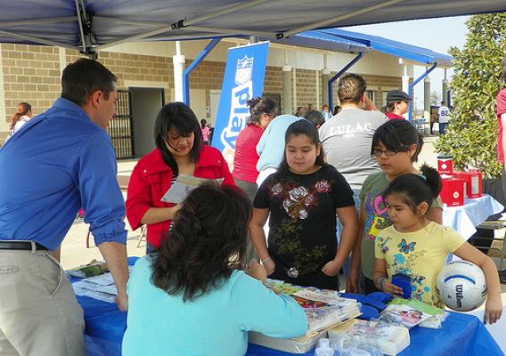 USDA FNS employees promoted HealthierUS information to Latino families at the NFL/LULAC Feria de Salud on Jan. 30.